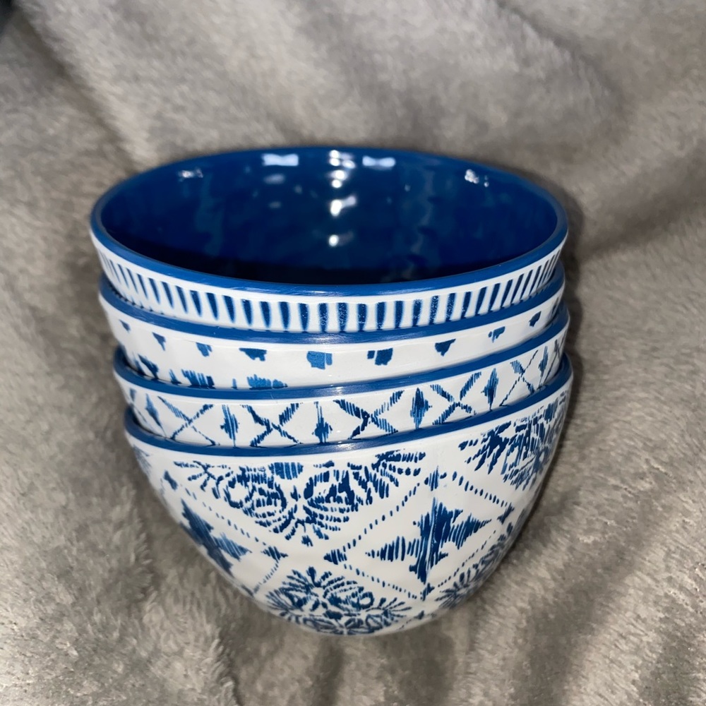 Four ceramic unique pattern small bowls